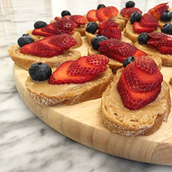 ThreeBrunch-Light-Bites_Macadamia-Butter-with-sliced-strawberries-and-blueberries-